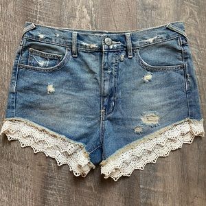 Free people denim shorts with lace trim